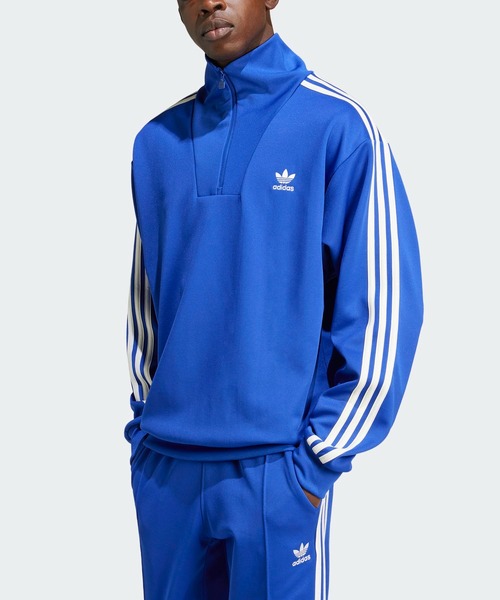 adidas（アディダス）の「アディカラー ファンネルネックトラック